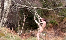 Naked self-bondage in the woods gone wrong.