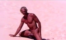 Tanned guy on beach in tiny string thong (temporarily!)