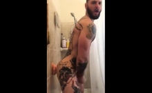 Tatted Hunk Fucks Dildo In Shower Until He Cums