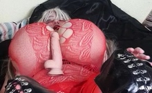 Susi In Red Fishnet She Is Wearing Black Boots Rubbing Pussy
